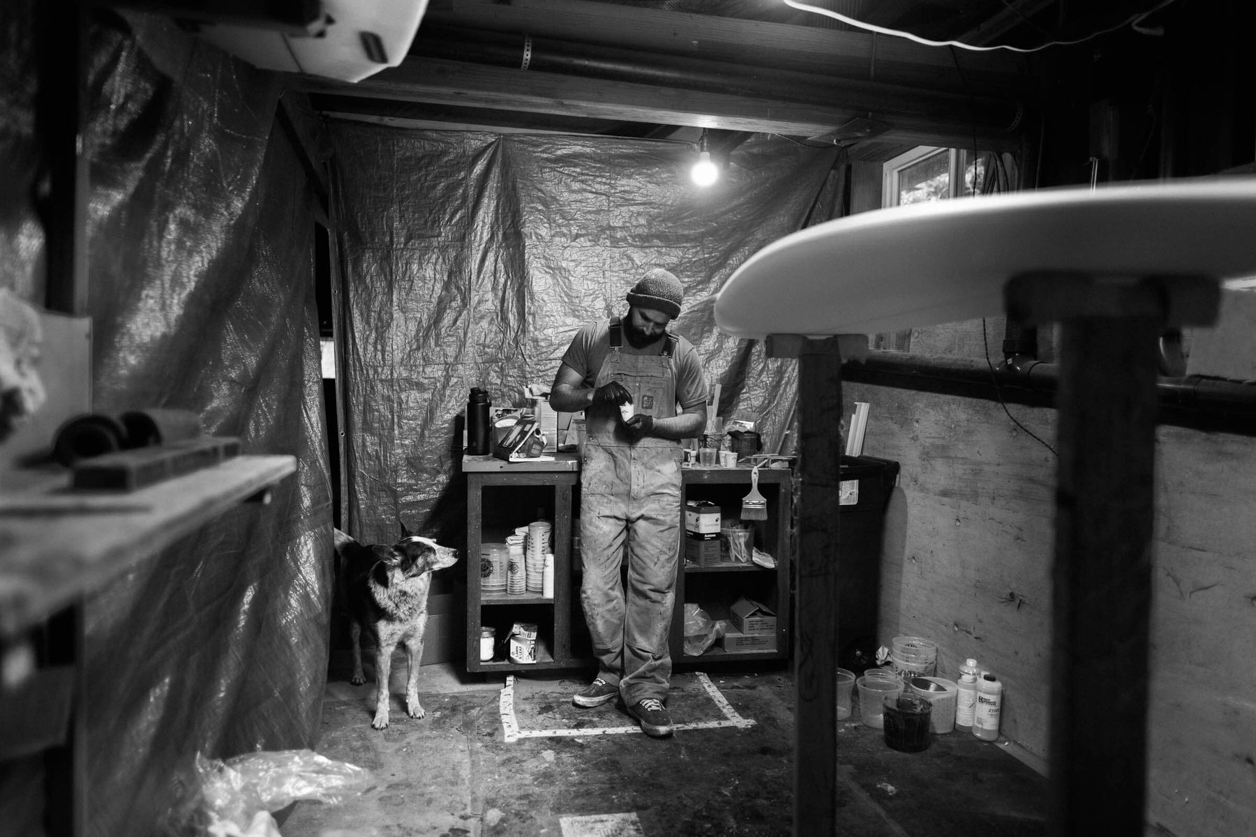 Hand-shaping a surfboard at Lazy Robot